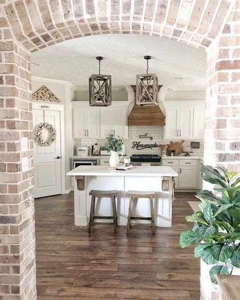 This classic white <b>kitchen</b> is accented by black countertops and stools, creating a stylish contrast. . Pinterest farmhouse kitchen